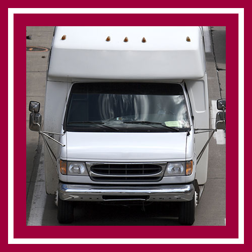 An image of a white shuttle bus