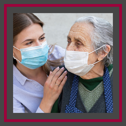 An image of a nurse providing care to a senior.
