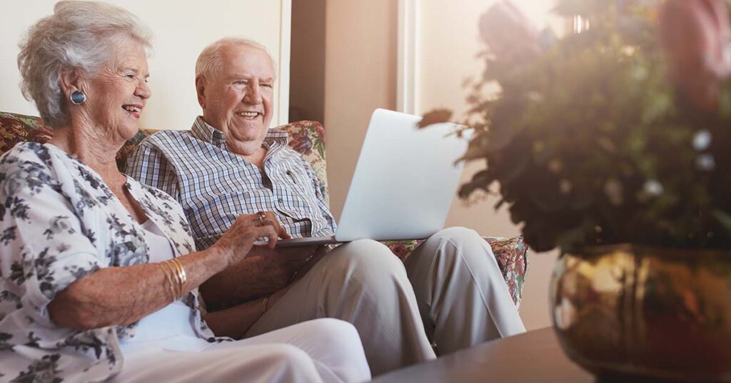 elderly couple sitting at home