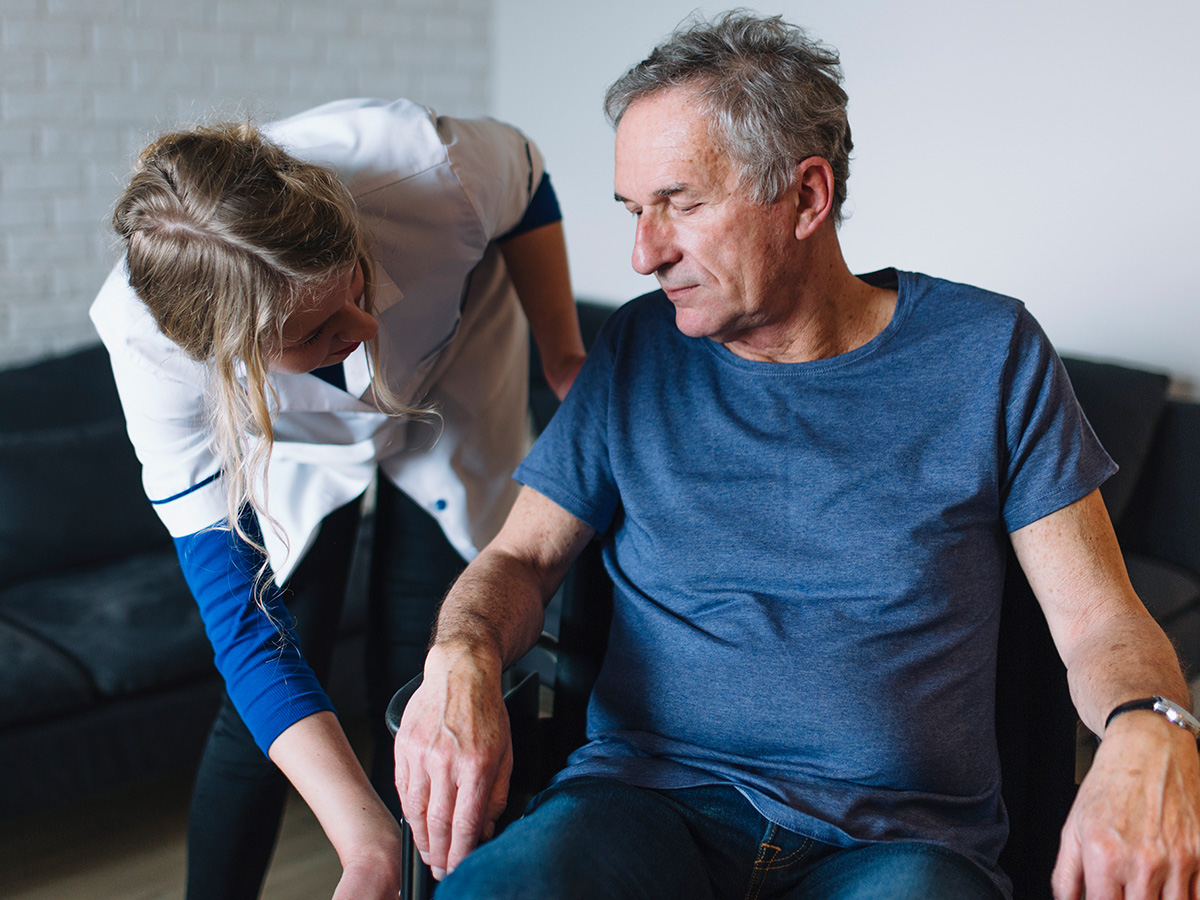 Image of a nurse working with a man with low energy